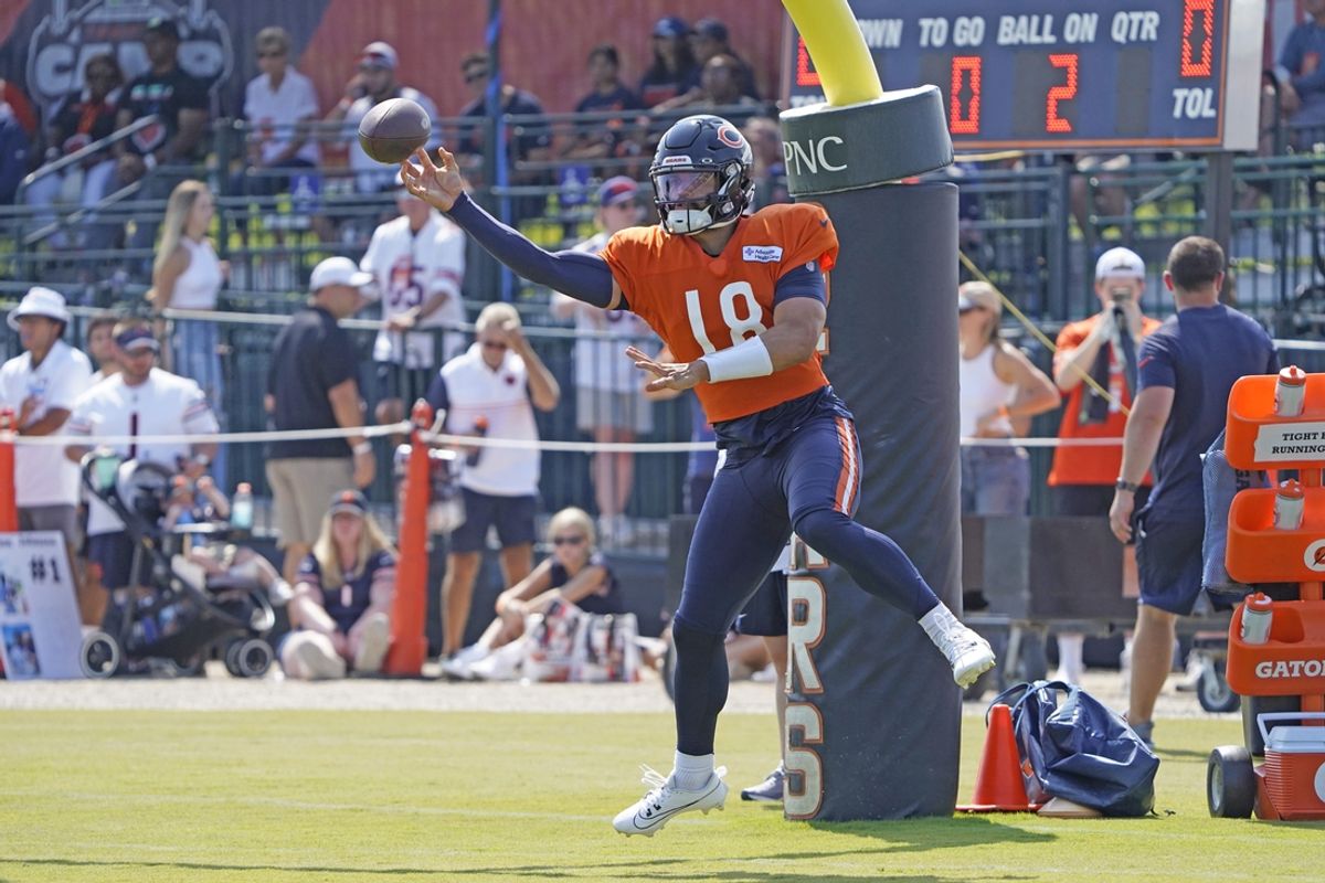 Jul 27, 2024; Lake Forest, IL, USA; Chicago Bears quarterback Caleb Williams (18) throws a pass during Chicago Bears Training Camp at Halas Hall. Mandatory Credit: David Banks-USA TODAY Sports