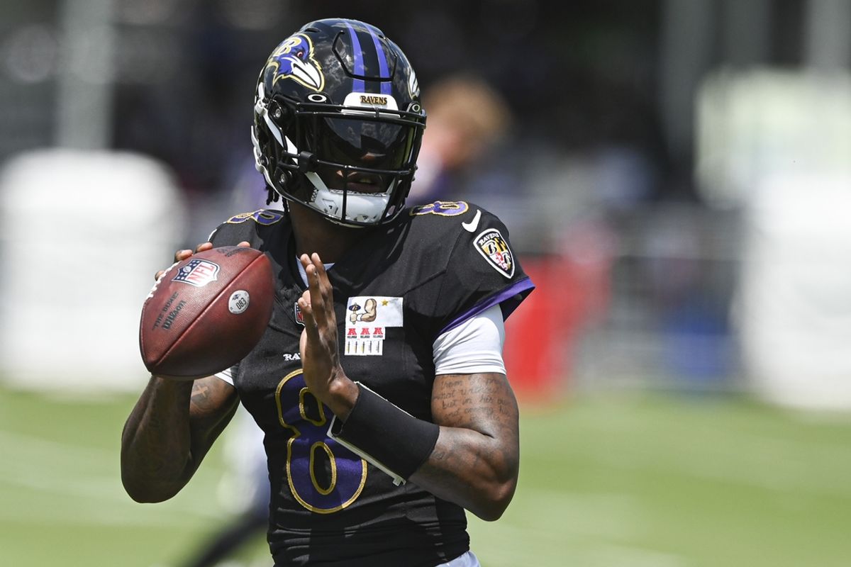 Jul 27, 2024; Owings Mill , MD, USA; Ravens quarterback Lamar Jackson (8) looks up field to throw during the afternoon session of training camp at the Under Armour Performance Center,  Mandatory Credit: Tommy Gilligan-USA TODAY Sports