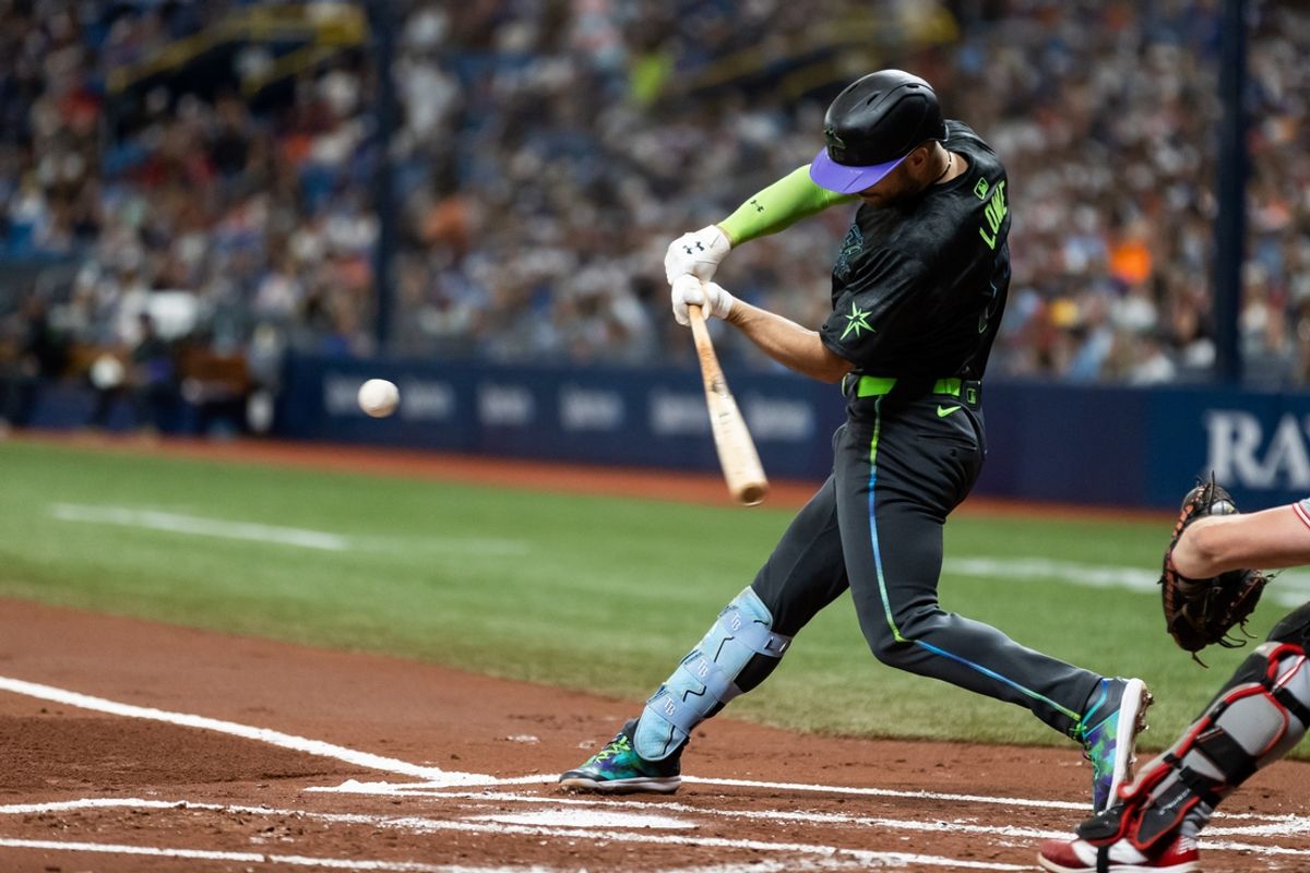Jul 27, 2024; St. Petersburg, Florida, USA; Tampa Bay Rays second base Brandon Lowe (8) hits for a double against the Cincinnati Reds during the first inning at Tropicana Field. Mandatory Credit: Matt Pendleton-USA TODAY Sports