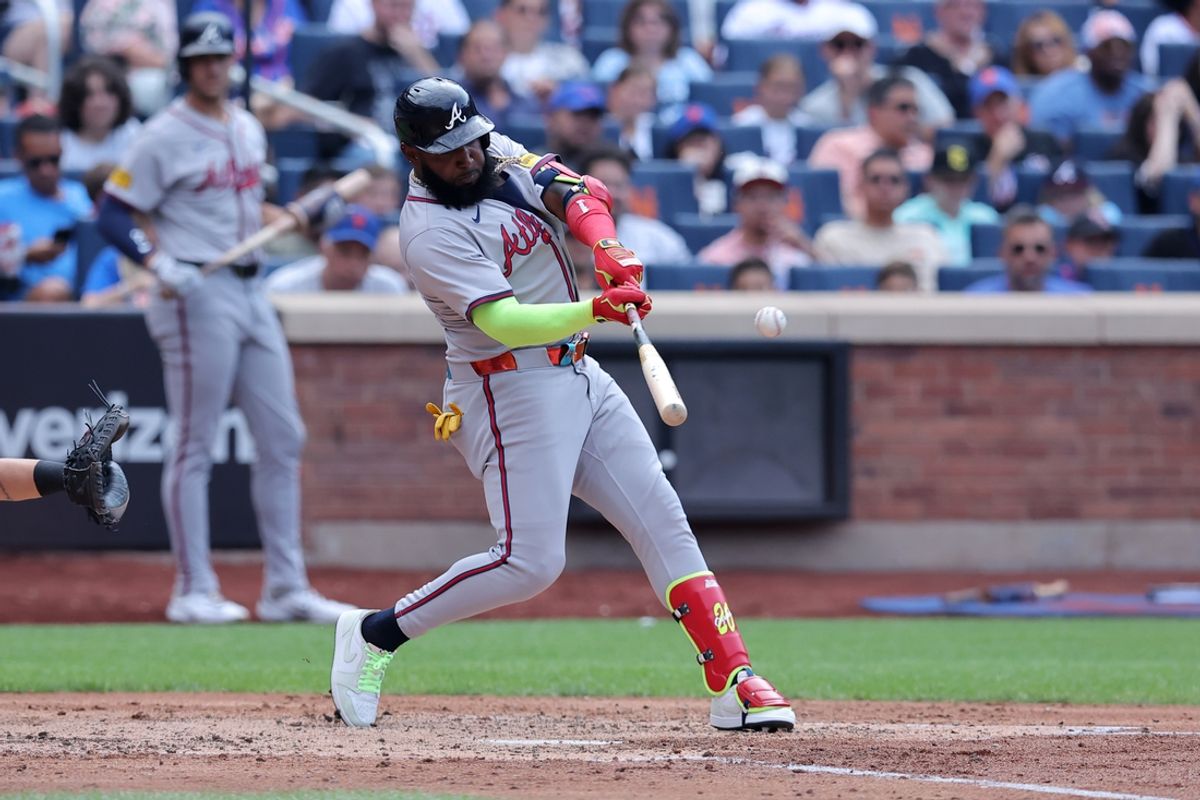 Jul 27, 2024; New York City, New York, USA; Atlanta Braves designated hitter Marcell Ozuna (20) hits a solo home run against the New York Mets during the fourth inning at Citi Field. Mandatory Credit: Brad Penner-USA TODAY Sports