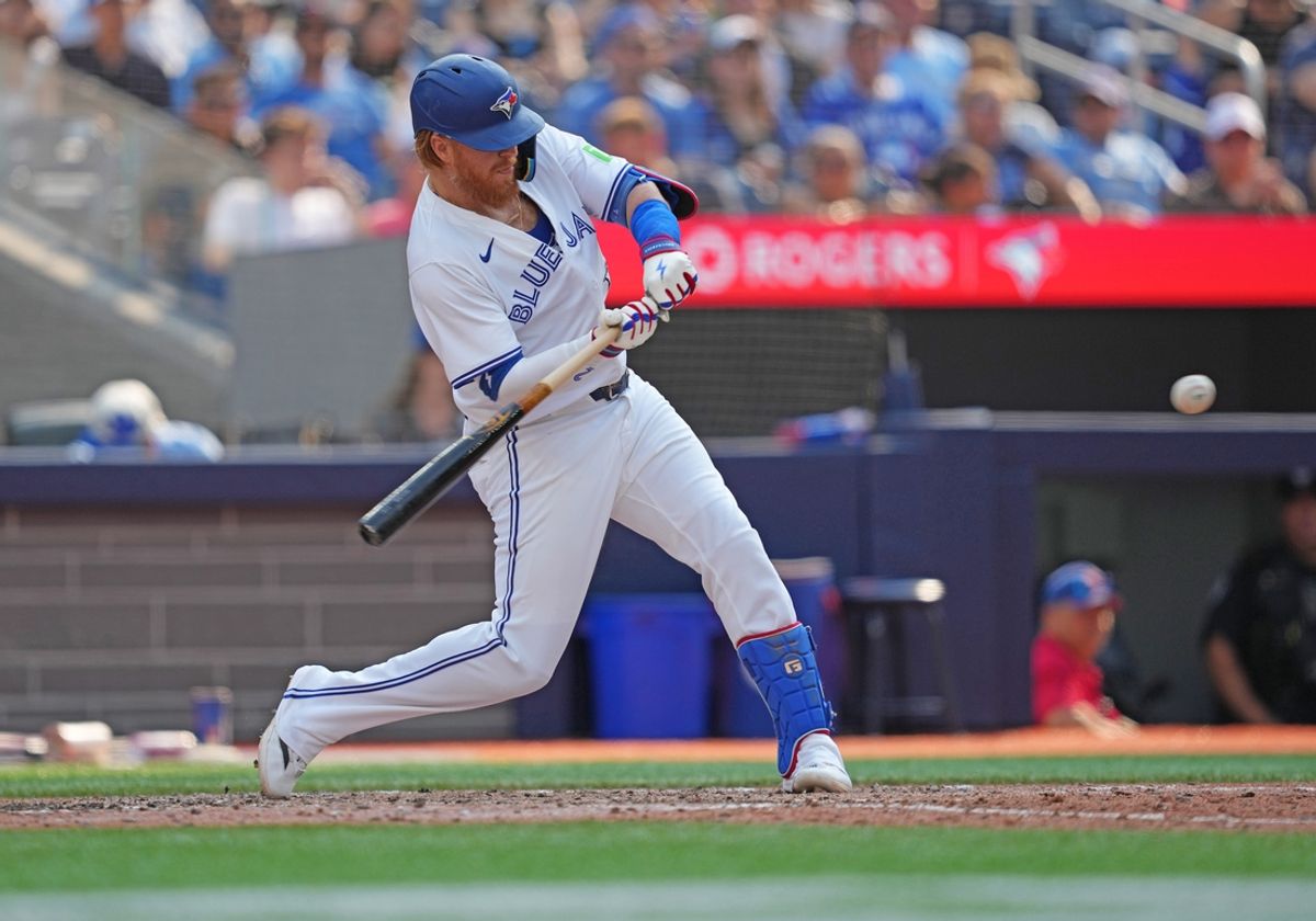 Jul 27, 2024; Toronto, Ontario, CAN; Toronto Blue Jays designated hitter Justin Turner (2) hits a double against the Texas Rangers during the eighth inning at Rogers Centre. Mandatory Credit: Nick Turchiaro-USA TODAY Sports