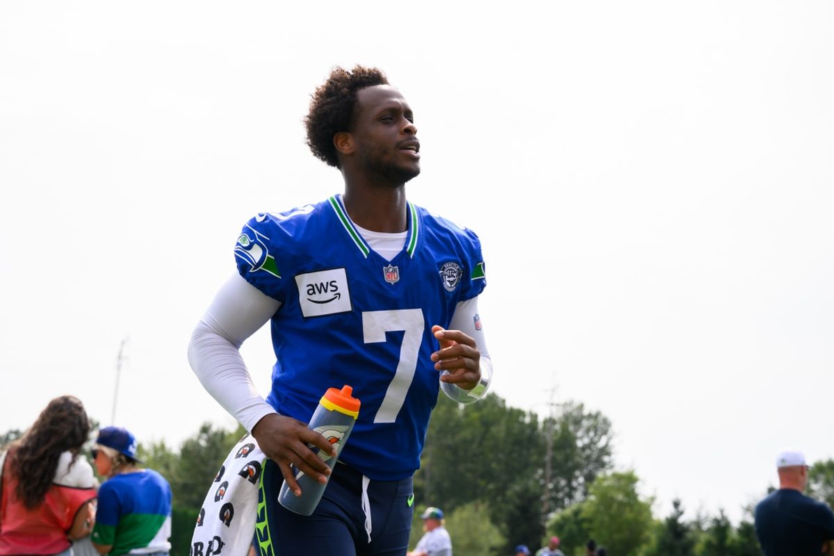 Jul 27, 2024; Renton, WA, USA; Seattle Seahawks quarterback Geno Smith (7) jogs off the field after training camp at Virginia Mason Athletic Center. Mandatory Credit: Steven Bisig-USA TODAY Sports