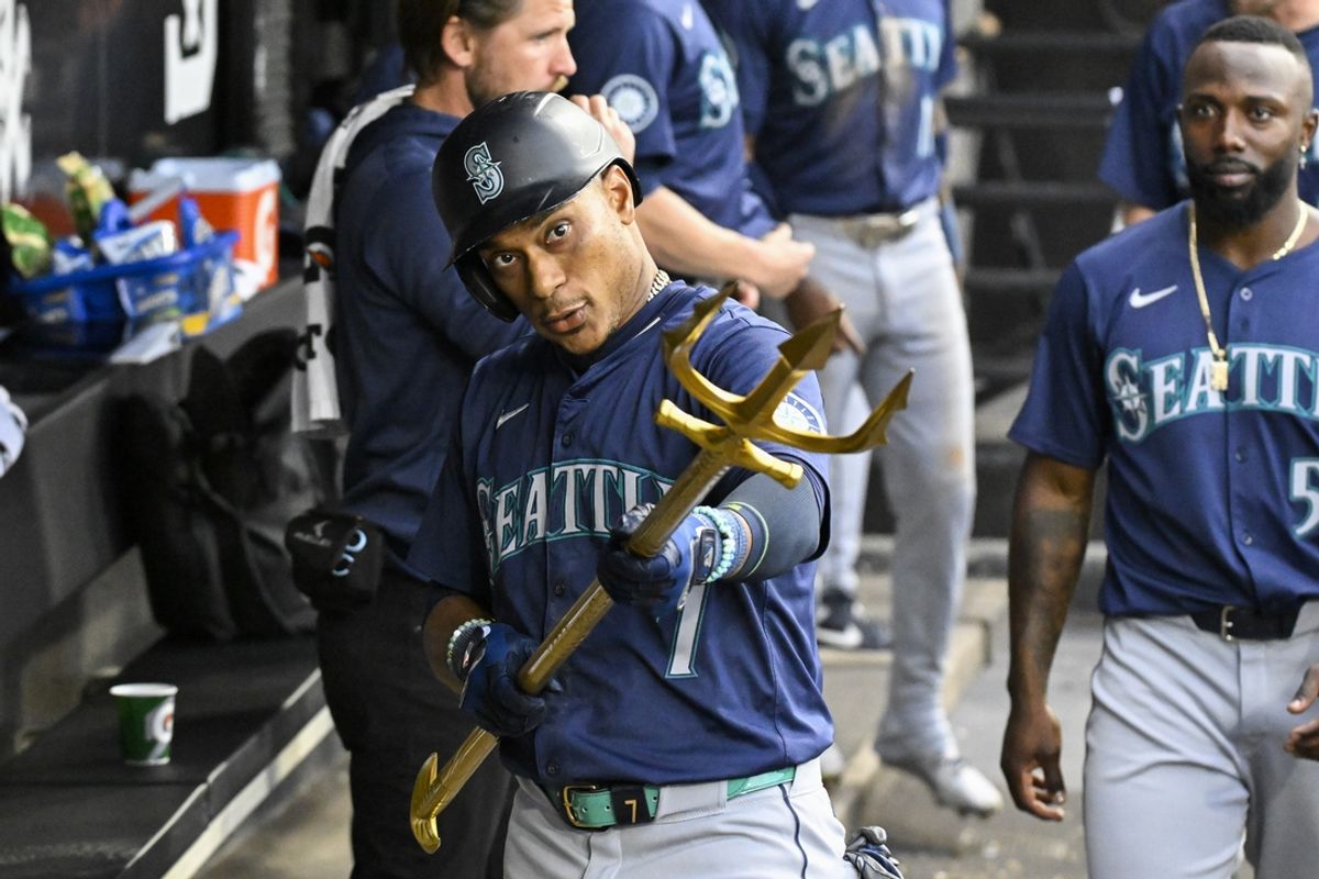 Jul 27, 2024; Chicago, Illinois, USA;  Seattle Mariners second baseman Jorge Polanco (7) celebrates in the dugout after hitting a home run against the Chicago White Sox during the fourth inning at Guaranteed Rate Field. Mandatory Credit: Matt Marton-USA TODAY Sports
