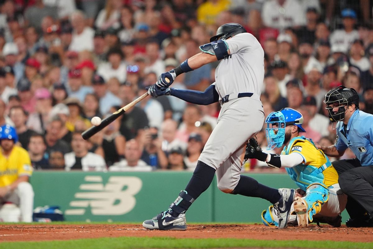 Jul 27, 2024; Boston, Massachusetts, USA; 
New York Yankees designated hitter Aaron Judge (99) hits an RBI single against the Boston Red Sox during the fifth inning at Fenway Park. Mandatory Credit: Gregory Fisher-USA TODAY Sports