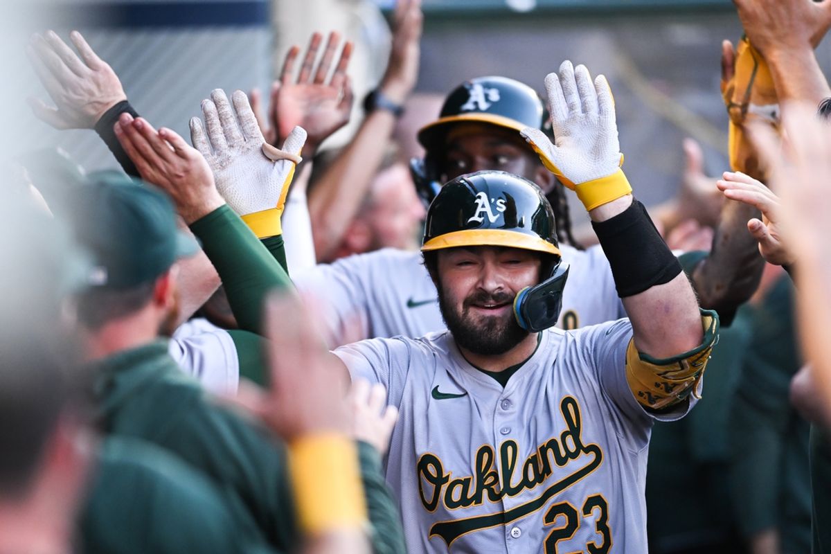 Jul 27, 2024; Anaheim, California, USA; Oakland Athletics catcher Shea Langeliers (23) celebrates teammates after hitting a three-run home run against the Los Angeles Angels during the first inning at Angel Stadium. Mandatory Credit: Jonathan Hui-USA TODAY Sports