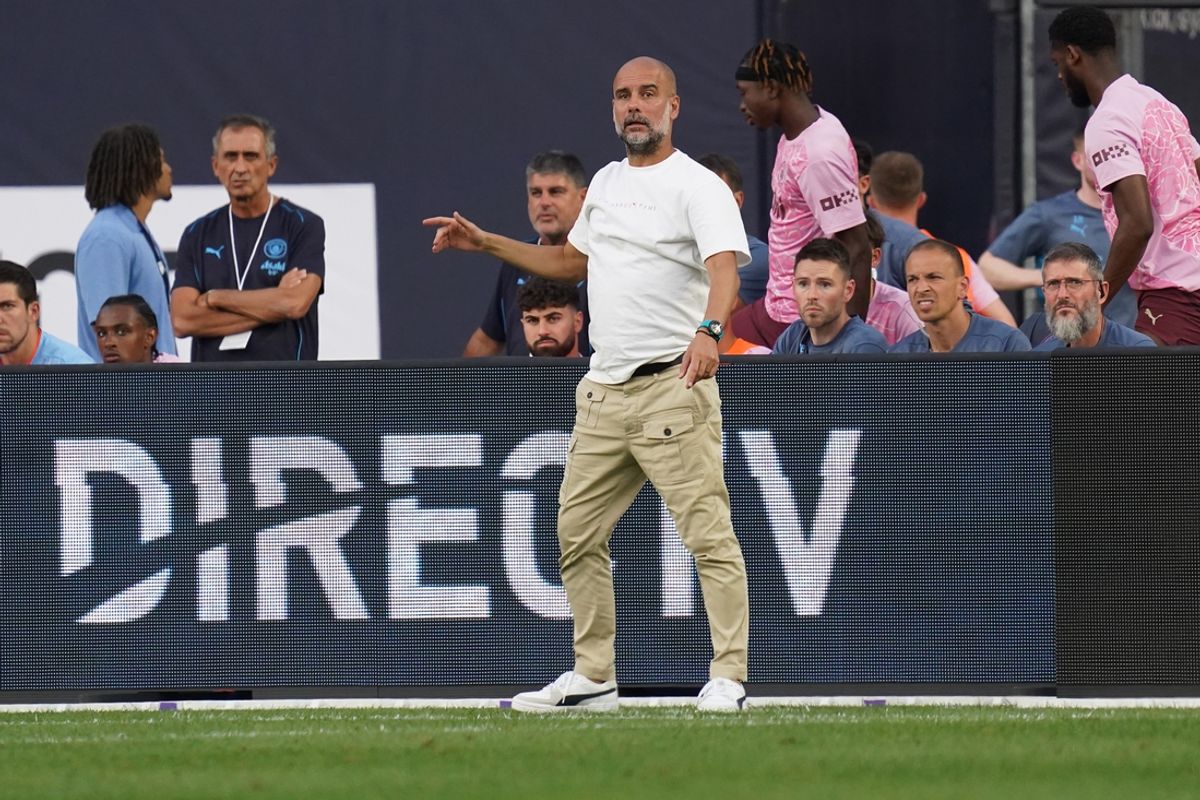Jul 27, 2024; New York, NY, USA; Manchester City head coach Pep Guardiola directs players during the first half against AC Milan at Yankee Stadium. Mandatory Credit: Lucas Boland-Imagn Images