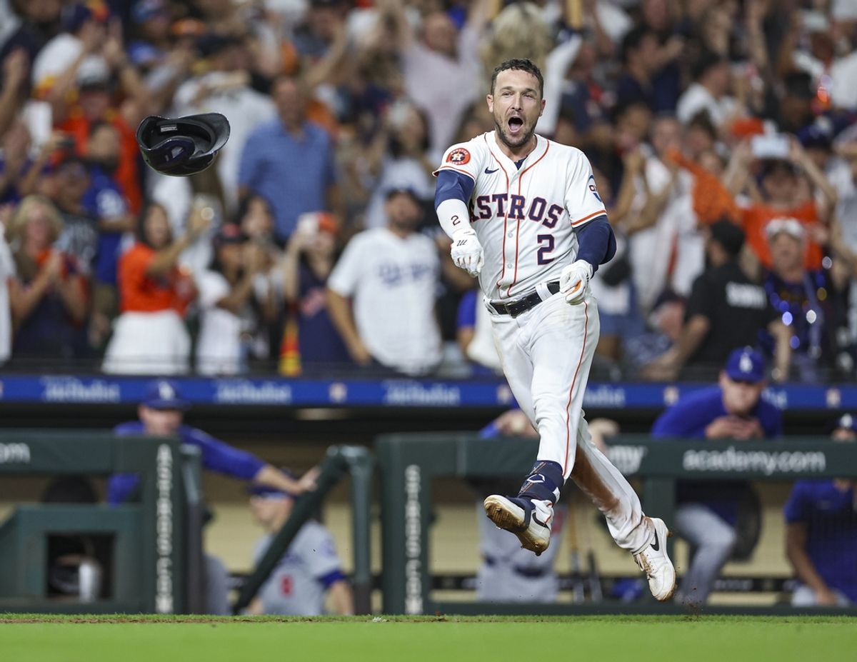 Jul 27, 2024; Houston, Texas, USA; Houston Astros third baseman Alex Bregman (2) throws his helmet after hitting a walk-off home run during the ninth inning against the Los Angeles Dodgers at Minute Maid Park. Mandatory Credit: Troy Taormina-USA TODAY Sports