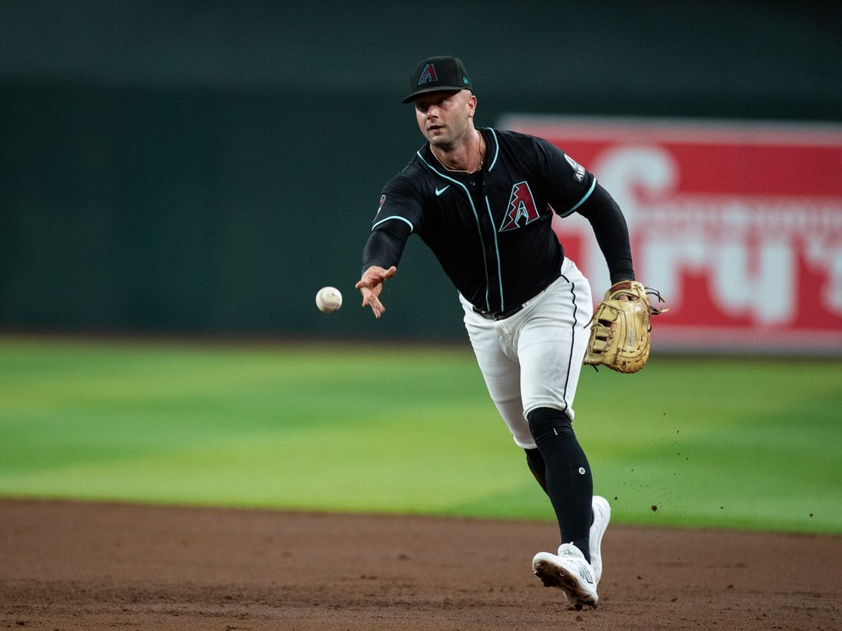 Arizona Diamondbacks first baseman Christian Walker (53) tosses the ball to first after fielding a sharp ground ball on July 27, 2024 at Chase Field in Phoenix.