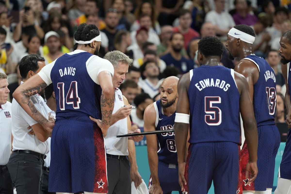 Jul 28, 2024; Villeneuve-d'Ascq, France; United States head coach Steve Kerr talks to the team during a timeout  in the first quarter against Serbia during the Paris 2024 Olympic Summer Games at Stade Pierre-Mauroy. Mandatory Credit: John David Mercer-USA TODAY Sports