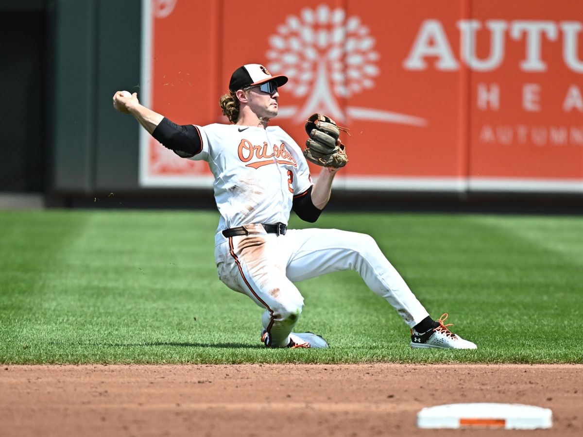 Jul 28, 2024; Baltimore, Maryland, USA;  Baltimore Orioles shortstop Gunnar Henderson (2) throws to first base during the second inning against the San Diego Padres at Oriole Park at Camden Yards. Mandatory Credit: James A. Pittman-USA TODAY Sports
