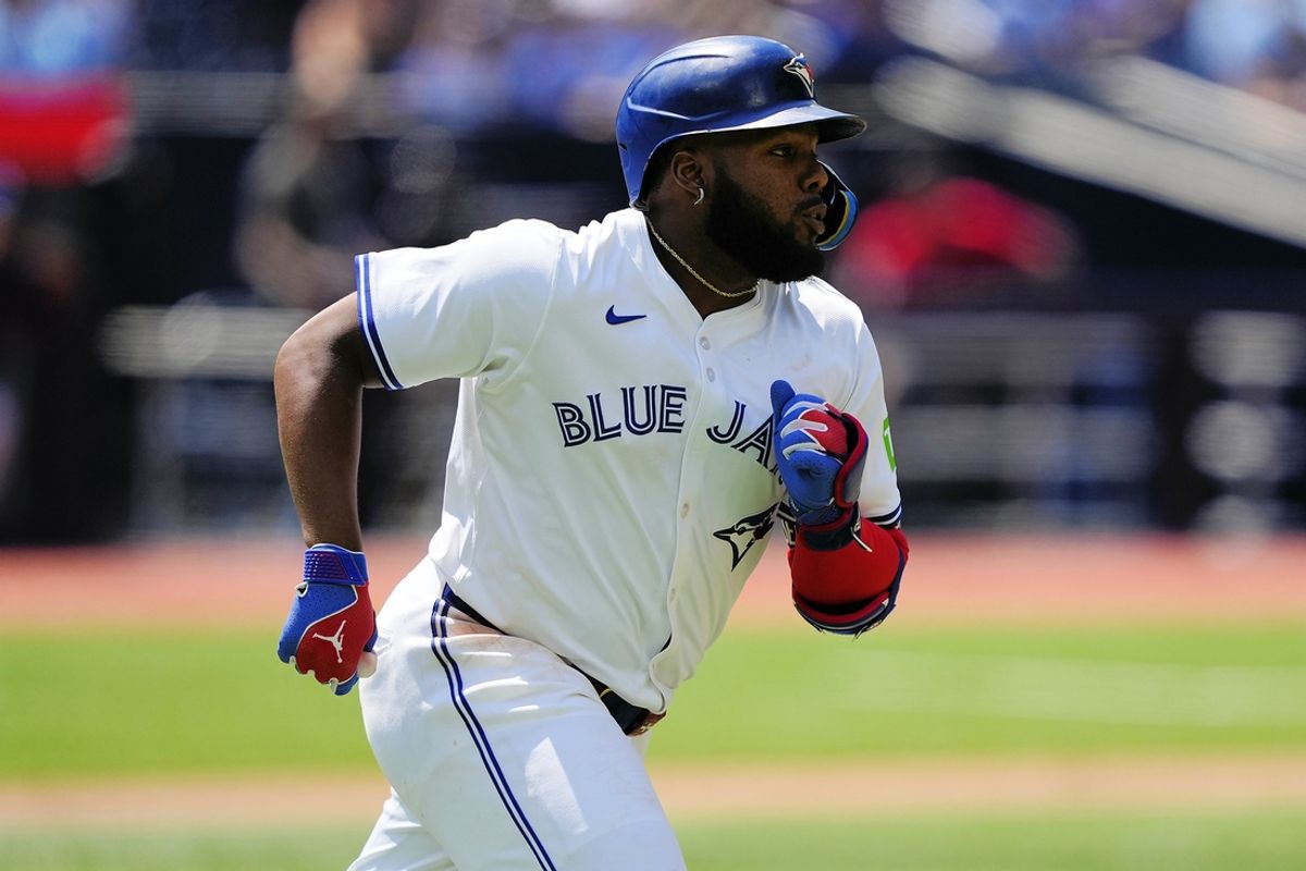 Jul 28, 2024; Toronto, Ontario, CAN; Toronto Blue Jays first baseman Vladimir Guerrero Jr. (27) runs to first base on his  solo home run against the Texas Rangers  during the third inning at Rogers Centre. Mandatory Credit: John E. Sokolowski-USA TODAY Sports