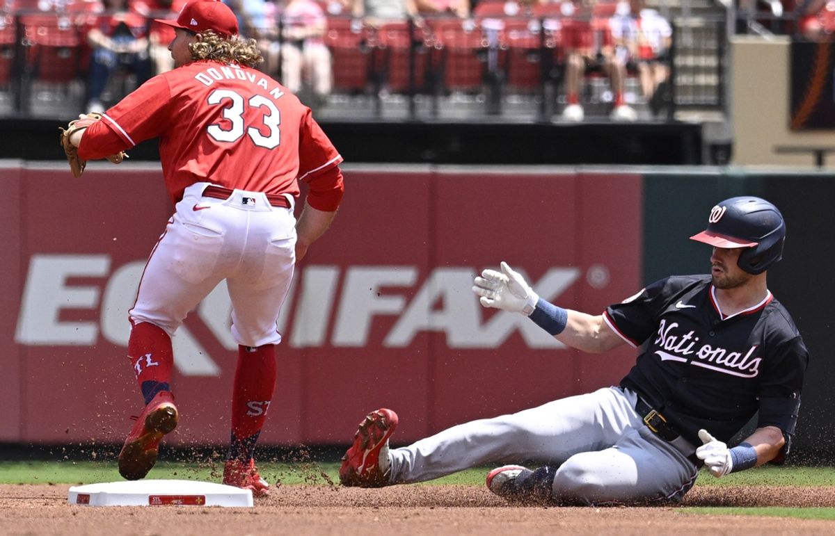 Jul 28, 2024; St. Louis, Missouri, USA; Washington Nationals right fielder Lane Thomas (28) slides safe after hitting a double against the St. Louis Cardinals during the first inning at Busch Stadium. Mandatory Credit: Jeff Le-USA TODAY Sports