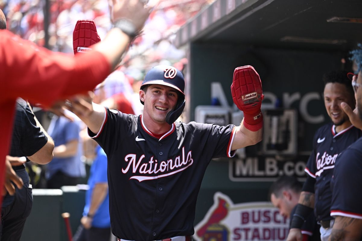 Jul 28, 2024; St. Louis, Missouri, USA; Washington Nationals center fielder Jacob Young (30) celebrates with teammates after scoring off a double by right fielder Lane Thomas (28) against the St. Louis Cardinals during the third inning at Busch Stadium. Mandatory Credit: Jeff Le-USA TODAY Sports