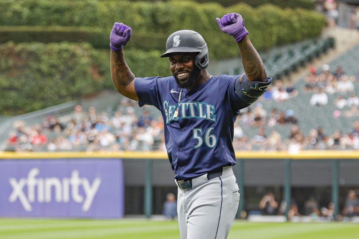 Jul 28, 2024; Chicago, Illinois, USA; Seattle Mariners outfielder Randy Arozarena (56) celebrates after hitting a single against the Chicago White Sox during the second inning at Guaranteed Rate Field. Mandatory Credit: Kamil Krzaczynski-USA TODAY Sports