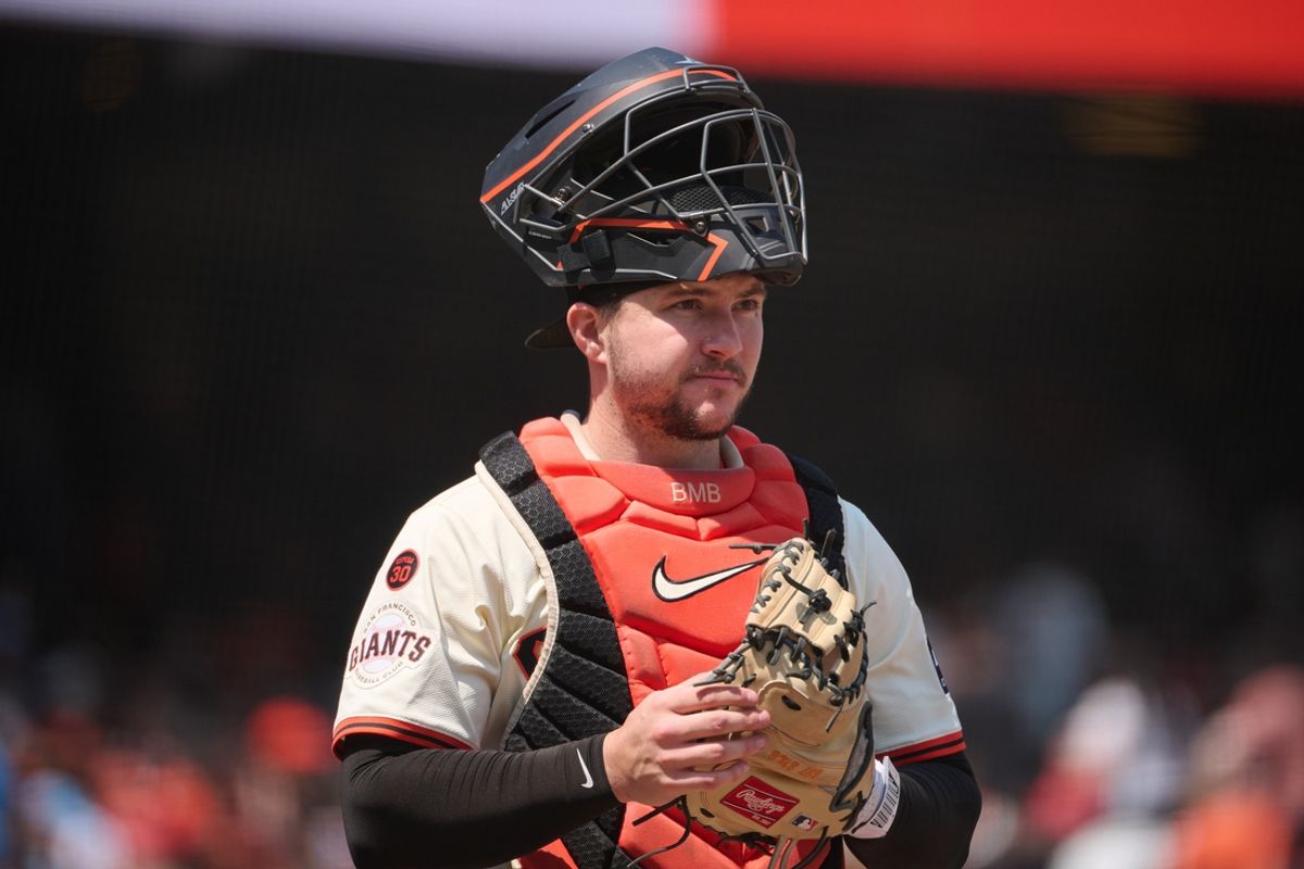 Jul 28, 2024; San Francisco, California, USA; San Francisco Giants catcher Patrick Bailey (14) stands on the field with his catchers mask raised against the Colorado Rockies during the fifth inning at Oracle Park. Mandatory Credit: Robert Edwards-USA TODAY Sports