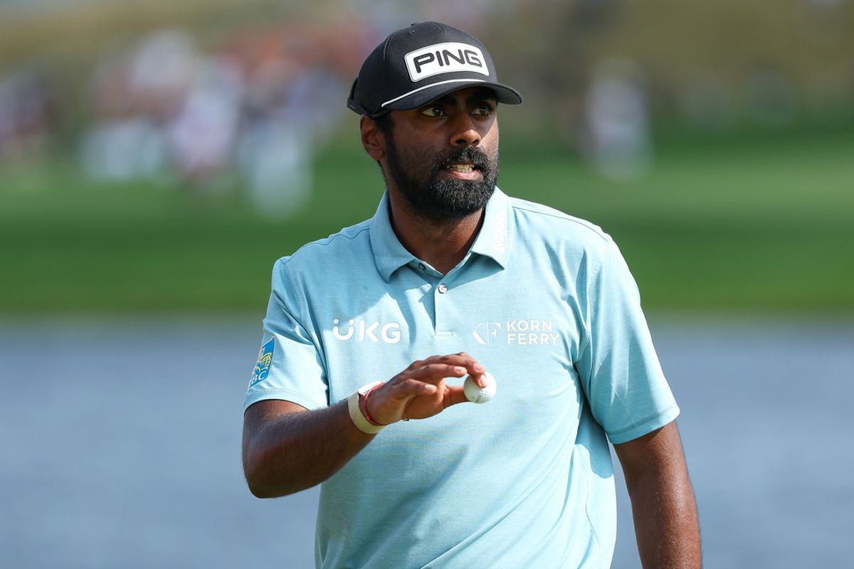 Jul 28, 2024; Blaine, Minnesota, USA; Sahith Theegala acknowledges the crowd on the 18th hole during the final round of the 3M Open golf tournament. Mandatory Credit: Matt Krohn-Imagn Images