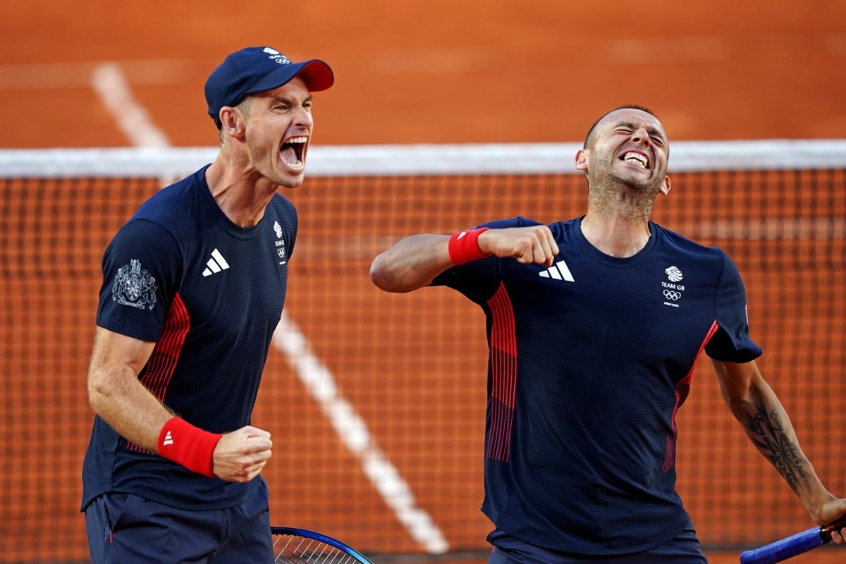 Jul 28, 2024; Paris, France; Andy Murray (GBR) and Daniel Evans (GBR) celebrate after beating Taro Daniel (JPN) and Kei Nishikori (JPN) in the men’s tennis doubles first round during the Paris 2024 Olympic Summer Games at Stade Roland Garros. Mandatory Credit: Amber Searls-USA TODAY Sports