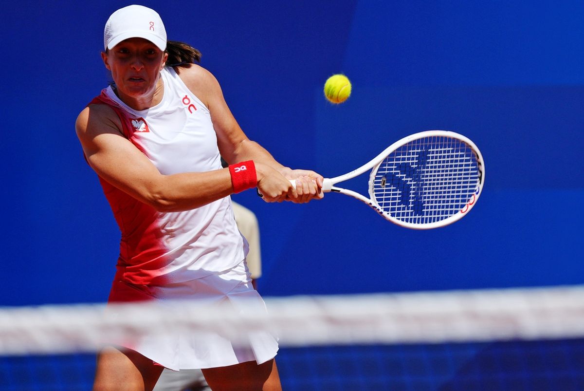 Jul 29, 2024; Paris, France; Iga Swiatek (POL) plays against Diane Parry (FRA) in the women’s tennis singles second round during the Paris 2024 Olympic Summer Games at Stade Roland Garros. Mandatory Credit: Amber Searls-Imagn Images
