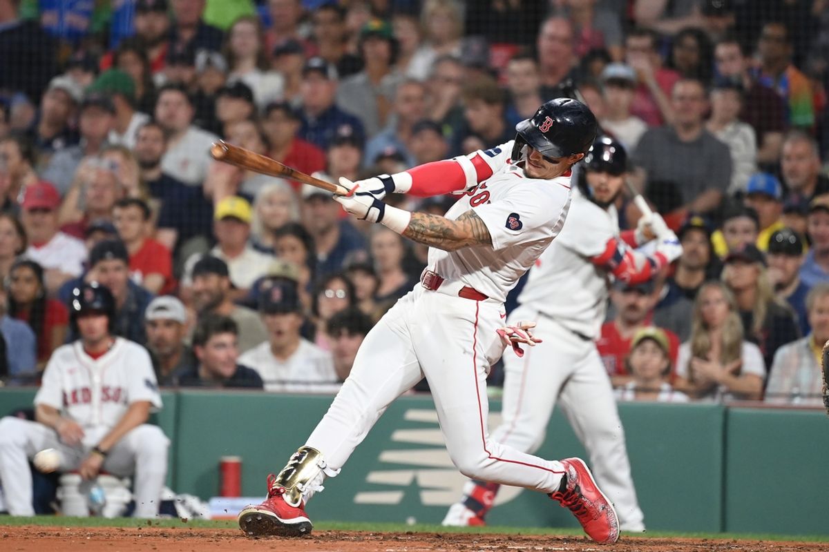 Jul 29, 2024; Boston, Massachusetts, USA; Boston Red Sox center fielder Jarren Duran (16) hits a double against the Seattle Mariners during the fourth inning at Fenway Park. Mandatory Credit: Eric Canha-USA TODAY Sports
