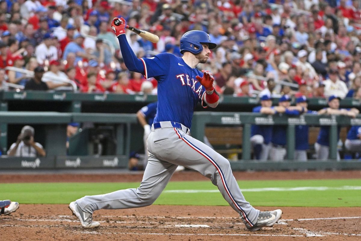 Jul 29, 2024; St. Louis, Missouri, USA;  Texas Rangers catcher Jonah Heim (28) hits a one run single against the St. Louis Cardinals during the fourth inning at Busch Stadium. Mandatory Credit: Jeff Curry-USA TODAY Sports