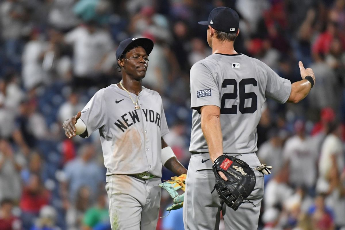 Jul 29, 2024; Philadelphia, Pennsylvania, USA; New York Yankees third baseman Jazz Chisholm, Jr (13) and New York Yankees third base DJ LeMahieu (26) celebrate win  against the Philadelphia Phillies at Citizens Bank Park. Mandatory Credit: Eric Hartline-USA TODAY Sports