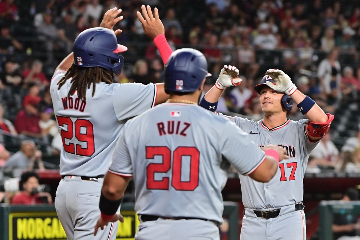 Jul 29, 2024; Phoenix, Arizona, USA;  Washington Nationals outfielder Alex Call (17) celebrates with outfielder James Wood (29) and catcher Keibert Ruiz (20) after hitting a three run home run in the first inning against the Arizona Diamondbacks at Chase Field. Mandatory Credit: Matt Kartozian-USA TODAY Sports