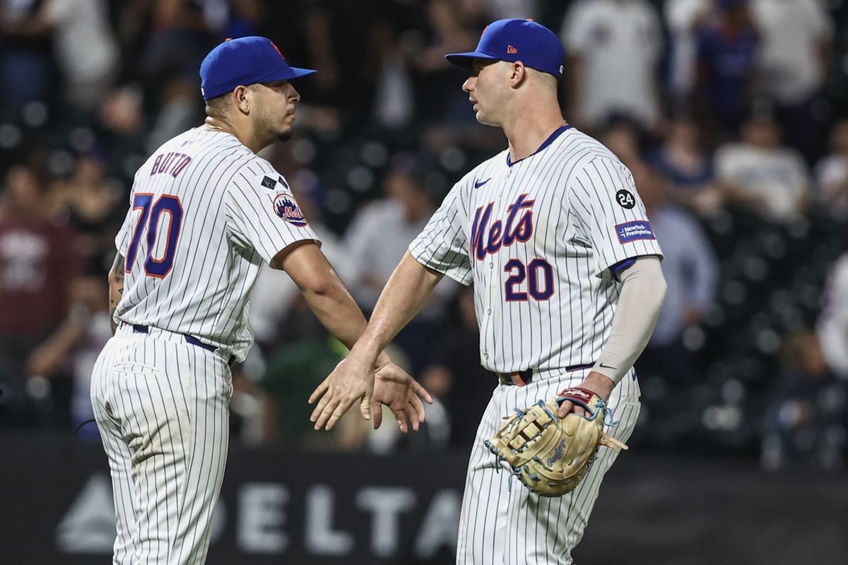 Jul 29, 2024; New York City, New York, USA;  New York Mets relief pitcher José Buttó (70) and first baseman Pete Alonso (20) celebrate after defeating the Minnesota Twins 15-2 at Citi Field. Mandatory Credit: Wendell Cruz-USA TODAY Sports