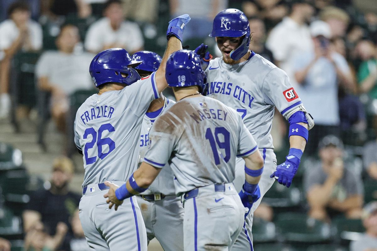 Jul 28, 2024; Chicago, Illinois, USA; Kansas City Royals shortstop Bobby Witt Jr. (7) celebrates with teammates after hitting a grand slam against the Chicago White Sox during the eight inning at Guaranteed Rate Field. Mandatory Credit: Kamil Krzaczynski-USA TODAY Sports