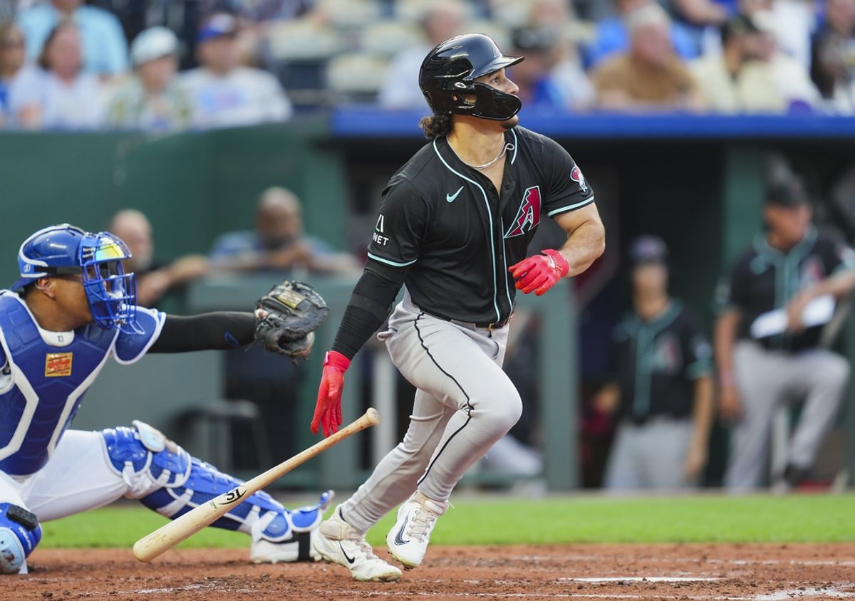Jul 22, 2024; Kansas City, Missouri, USA; Arizona Diamondbacks center fielder Alek Thomas (5) hits an RBI double against the Kansas City Royals during the third inning at Kauffman Stadium. Mandatory Credit: Jay Biggerstaff-USA TODAY Sports