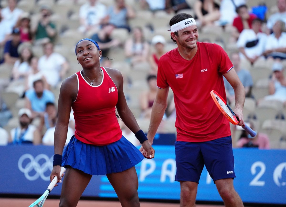 Jul 30, 2024; Paris, France;  Coco Gauff (USA) and Taylor Fritz (USA) react during a mixed doubles tennis match during the Paris 2024 Olympic Summer Games at Stade Roland Garros. Mandatory Credit: Kirby Lee-Imagn Images