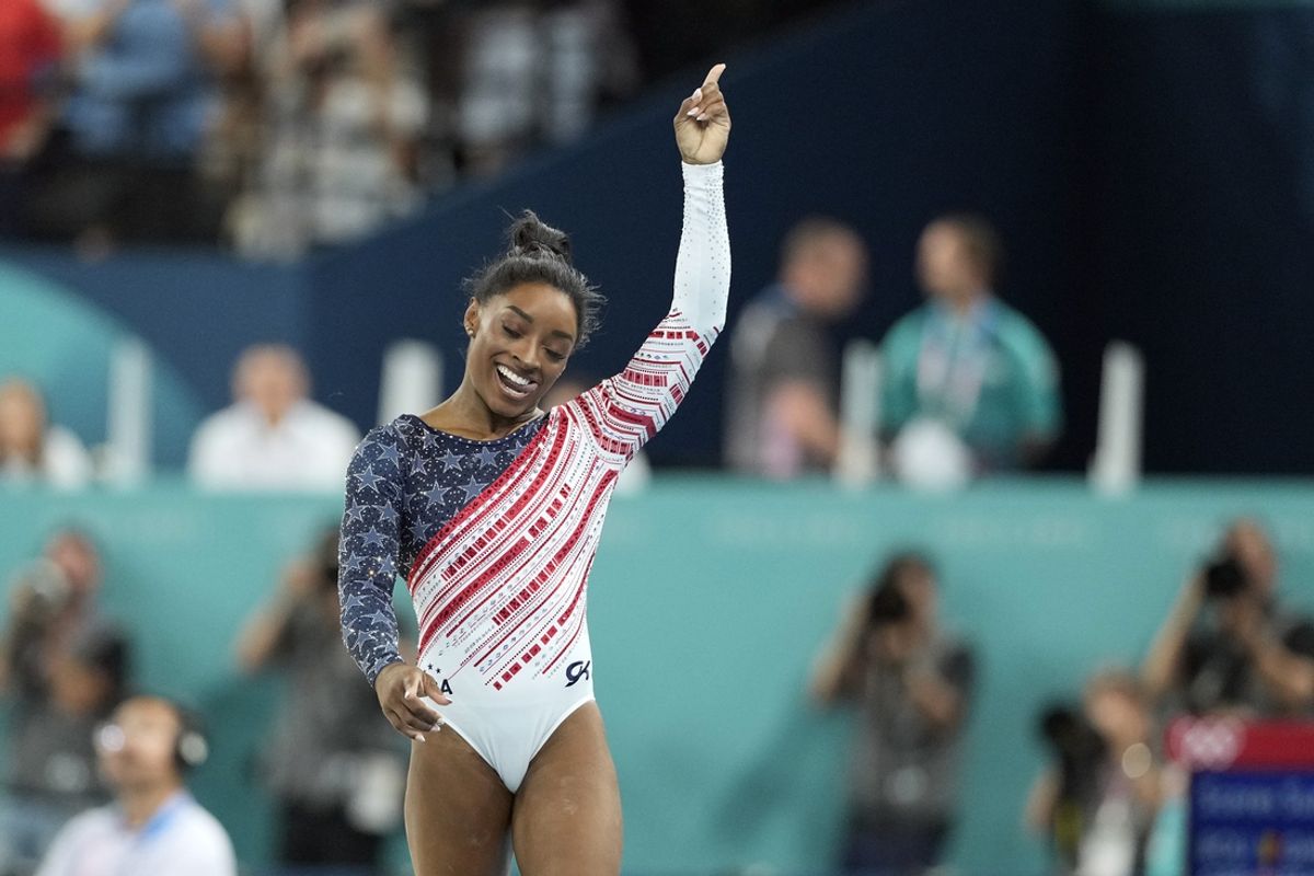 Jul 30, 2024; Paris, France; Simone Biles of the United States holds up the number one after the women’s team final at the Paris 2024 Olympic Summer Games at Bercy Arena. Mandatory Credit: Kyle Terada-USA TODAY Sports
