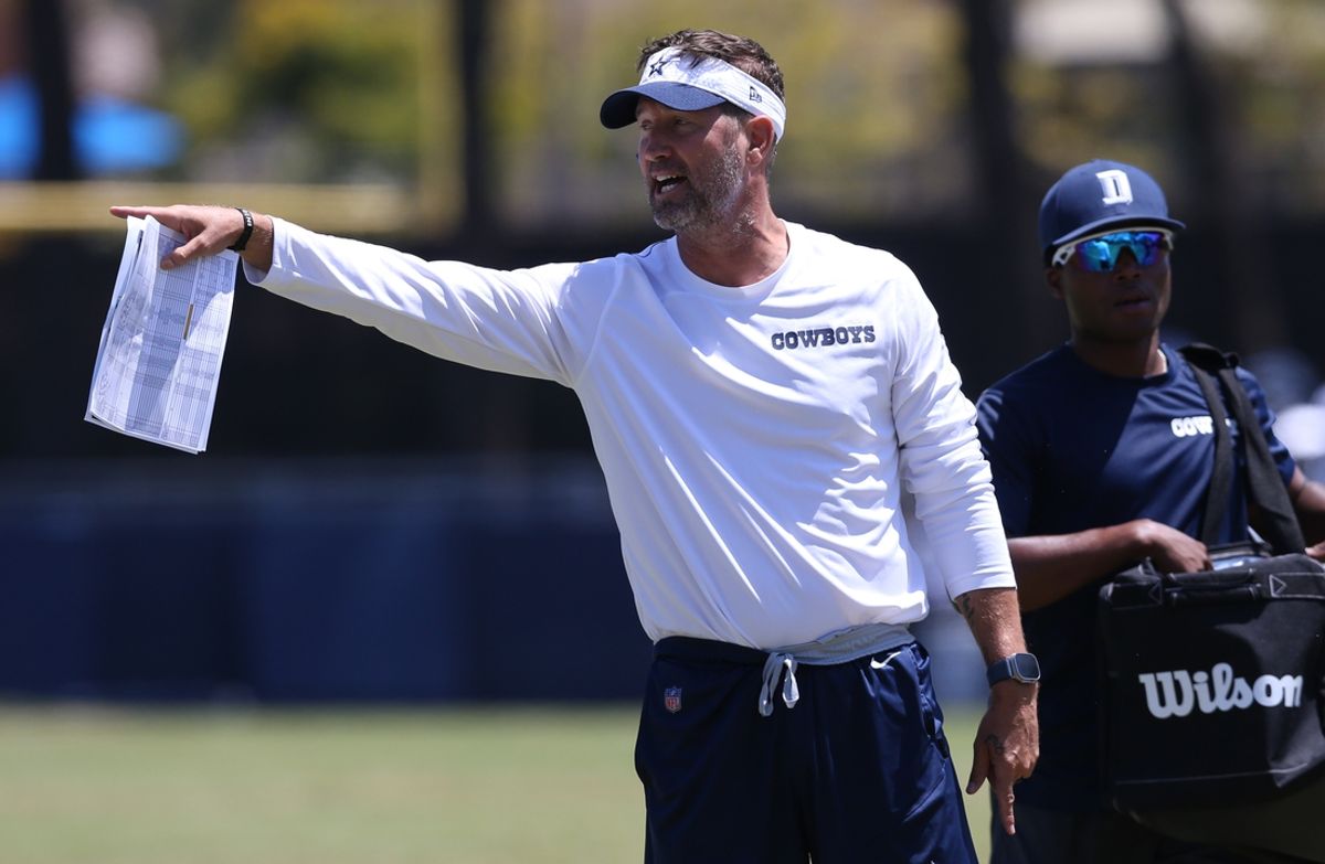 Jul 30, 2024; Oxnard, CA, USA; Dallas Cowboys offensive coordinator Brian Schottenheimer during training camp at the River Ridge Playing Fields in Oxnard, California. Mandatory Credit: Jason Parkhurst-Imagn Images