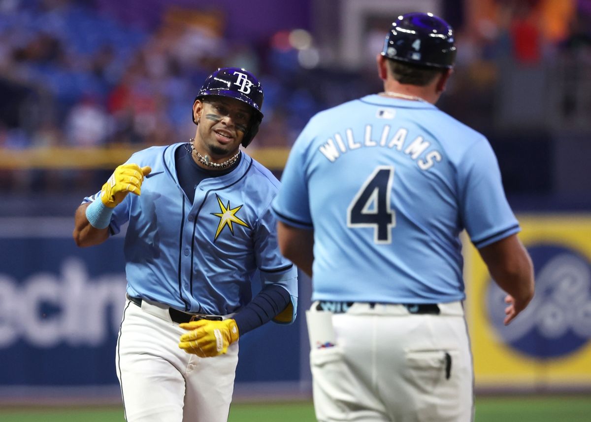 Jul 30, 2024; St. Petersburg, Florida, USA;  Tampa Bay Rays infielder Christopher Morel (24) is congratulated by third base coach Brady Williams (4) after he hits a home run against the Miami Marlins during the fourth inning at Tropicana Field. Mandatory Credit: Kim Klement Neitzel-USA TODAY Sports