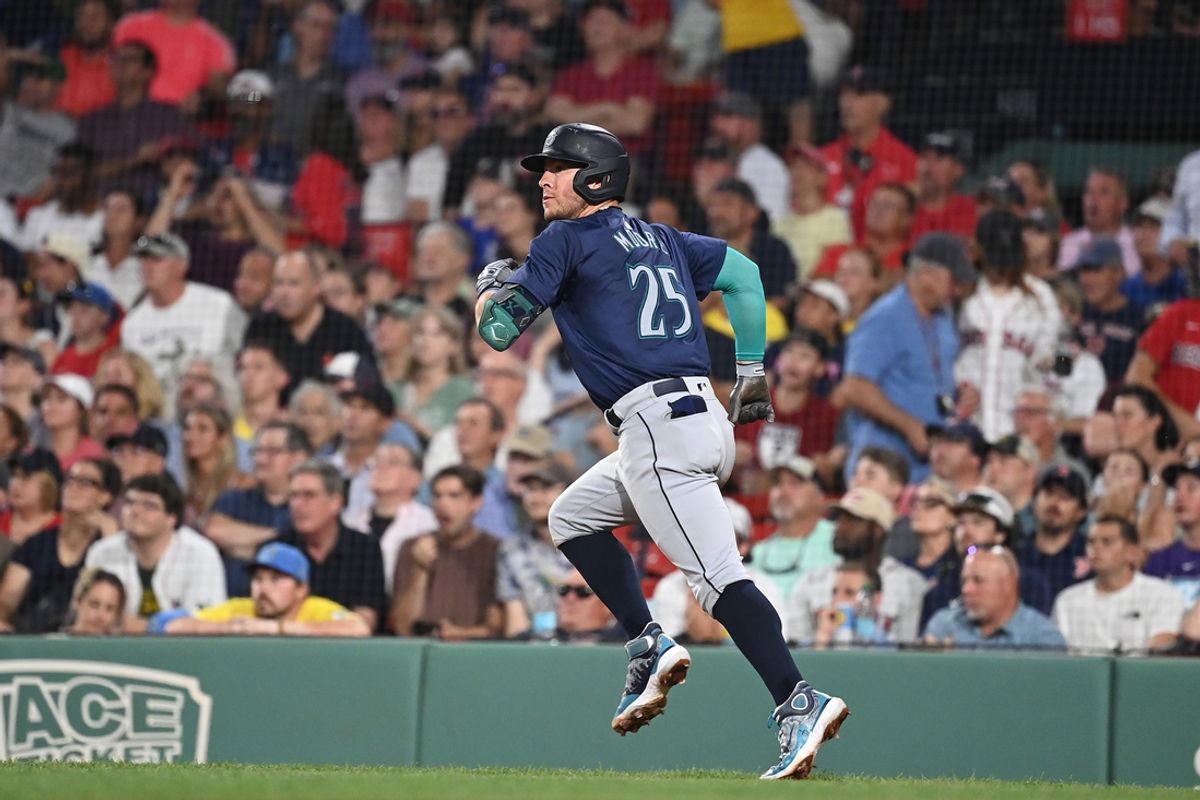 Jul 30, 2024; Boston, Massachusetts, USA; Seattle Mariners third baseman Dylan Moore (25) hits an RBI double against the Boston Red Sox during the fifth inning at Fenway Park. Mandatory Credit: Eric Canha-USA TODAY Sports