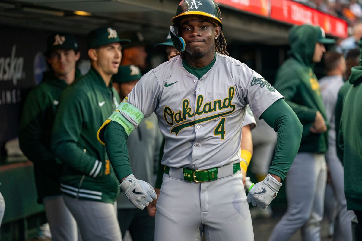 Jul 30, 2024; San Francisco, California, USA;  Oakland Athletics right fielder Lawrence Butler (4) poses for the TV cameras after hitting a solo home run against the San Francisco Giants during the third inning at Oracle Park. Mandatory Credit: Neville E. Guard-USA TODAY Sports
