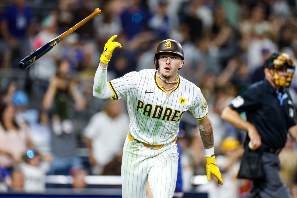 Jul 30, 2024; San Diego, California, USA; San Diego Padres center fielder Jackson Merrill (3) flips his bat after hitting a one-run home run during the ninth inning against the Los Angeles Dodgers at Petco Park. Mandatory Credit: David Frerker-USA TODAY Sports