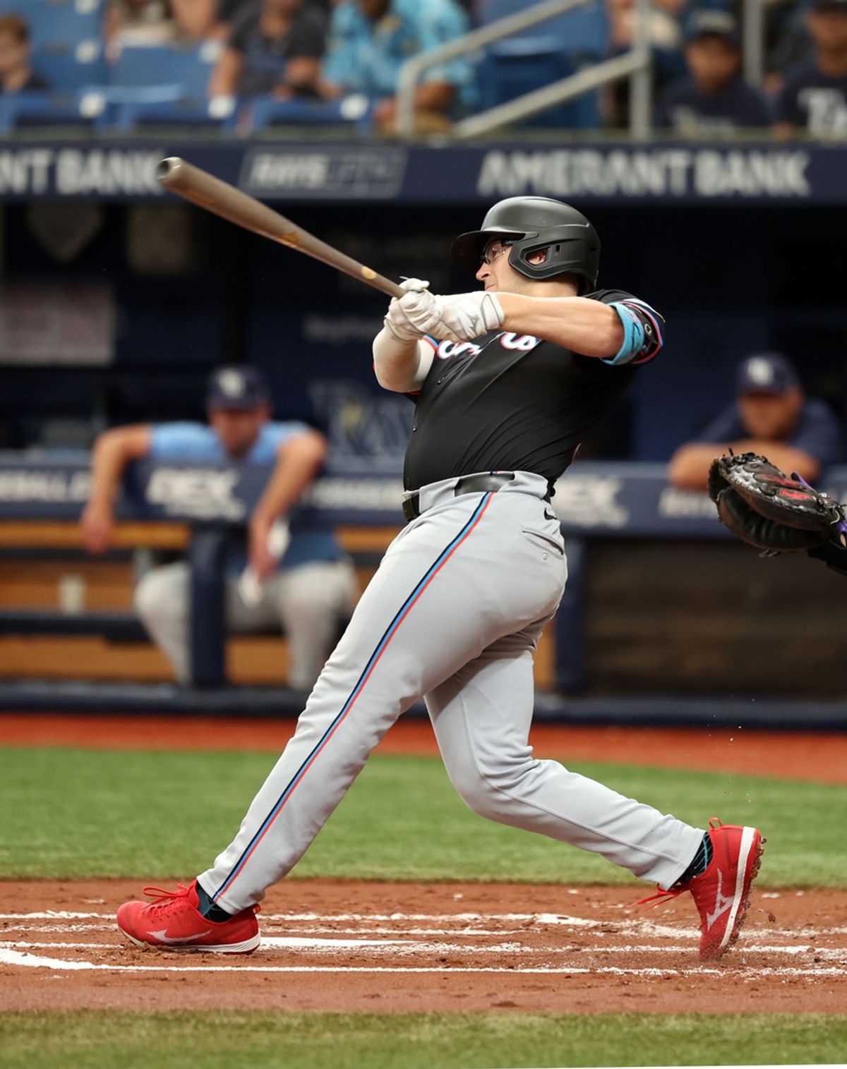 Jul 31, 2024; St. Petersburg, Florida, USA; Miami Marlins third baseman Jonah Bride (41) hits a home run against the Tampa Bay Rays during the second inning at Tropicana Field. Mandatory Credit: Kim Klement Neitzel-USA TODAY Sports