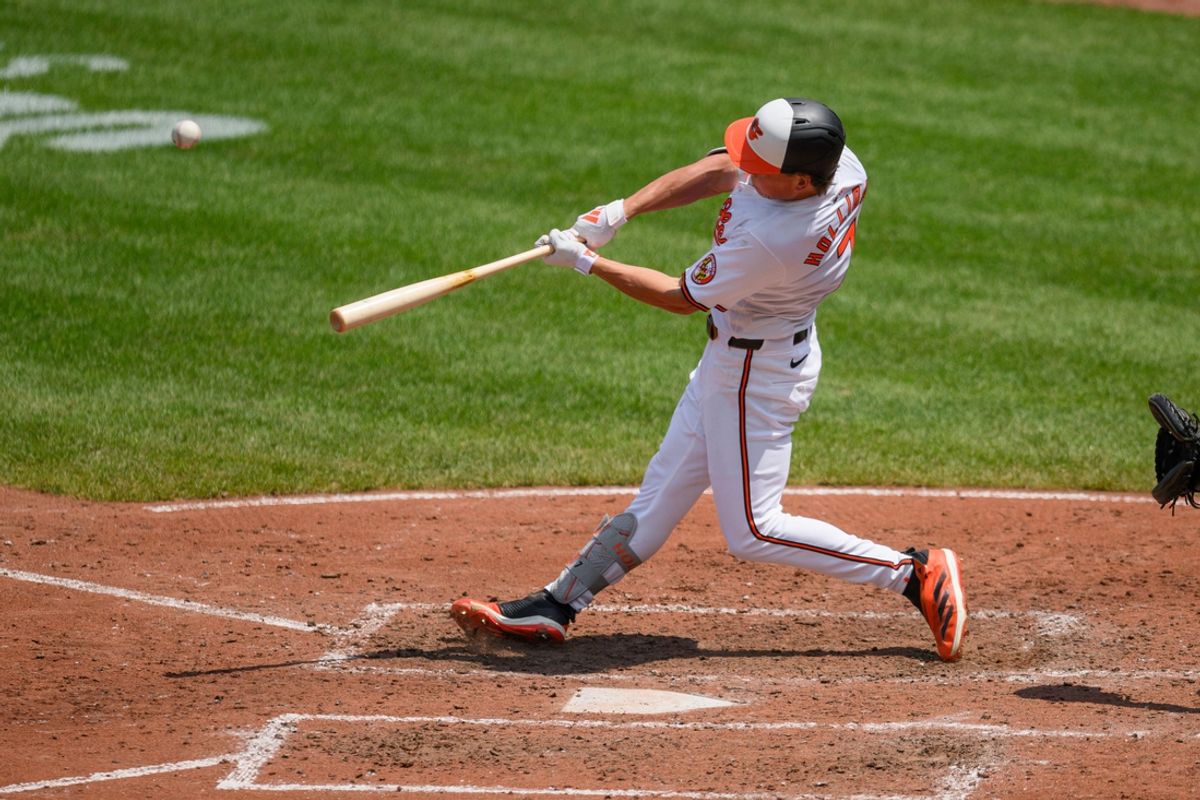Jul 31, 2024; Baltimore, Maryland, USA; Baltimore Orioles second baseman Jackson Holliday (7) hits a home run against the Toronto Blue Jays during the fifth inning at Oriole Park at Camden Yards. Mandatory Credit: Reggie Hildred-USA TODAY Sports