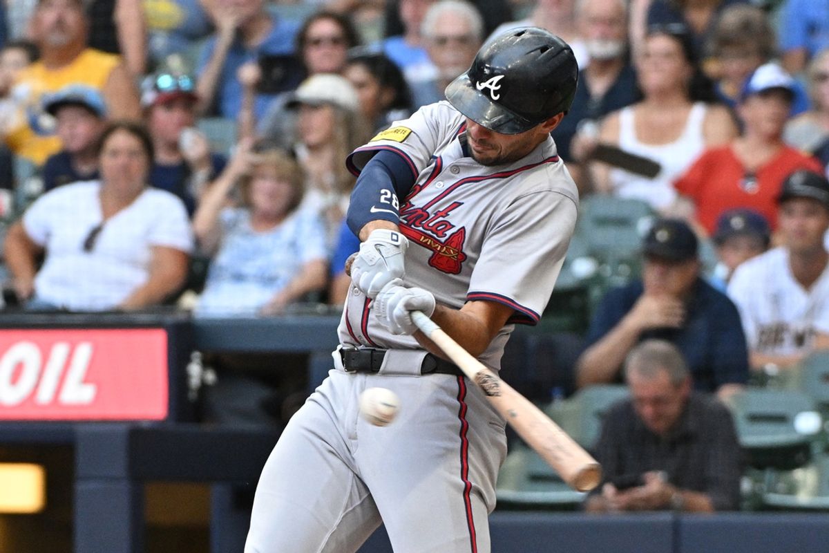 Jul 31, 2024; Milwaukee, Wisconsin, USA; Atlanta Braves first base Matt Olson (28) hits a home run against the Milwaukee Brewers in the fourth inning at American Family Field. Mandatory Credit: Michael McLoone-USA TODAY Sports