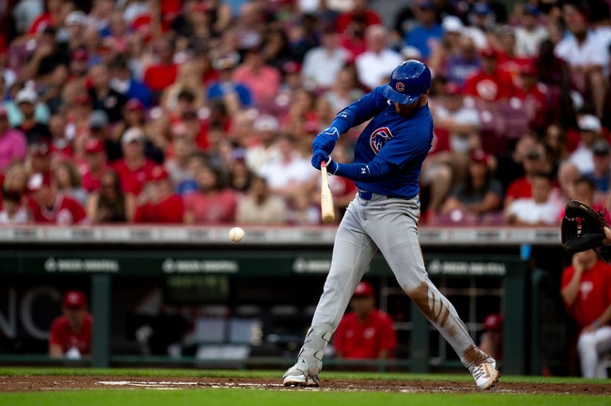 Chicago Cubs designated hitter Cody Bellinger (2) hits a base hit in the third inning of the MLB game between the Cincinnati Reds and the Chicago Cubs at Great American Ballpark in Cincinnati on Wednesday, July 31, 2024.