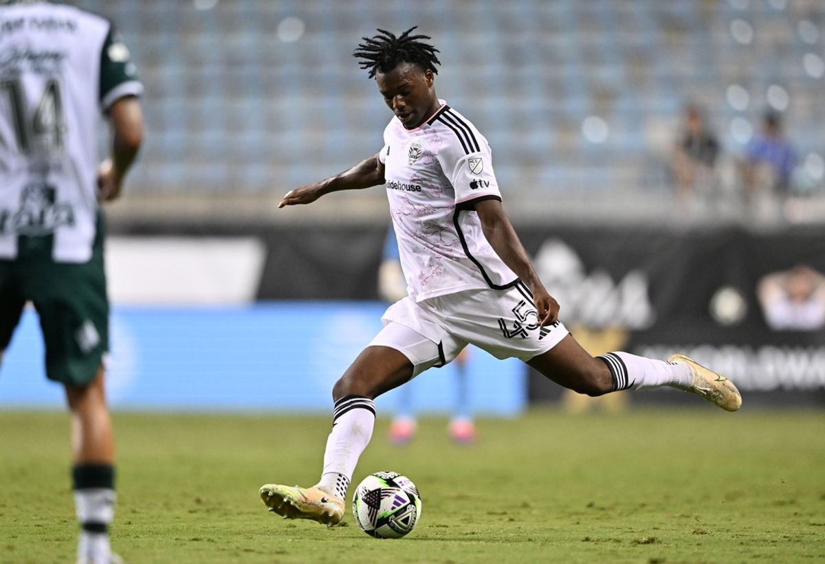 Jul 31, 2024; Chester, Pennsylvania, USA; D.C. United defender Matai Akinmboni (45) passes the ball against Santos Laguna in the first half at Subaru Park. Mandatory Credit: Kyle Ross-Imagn Images