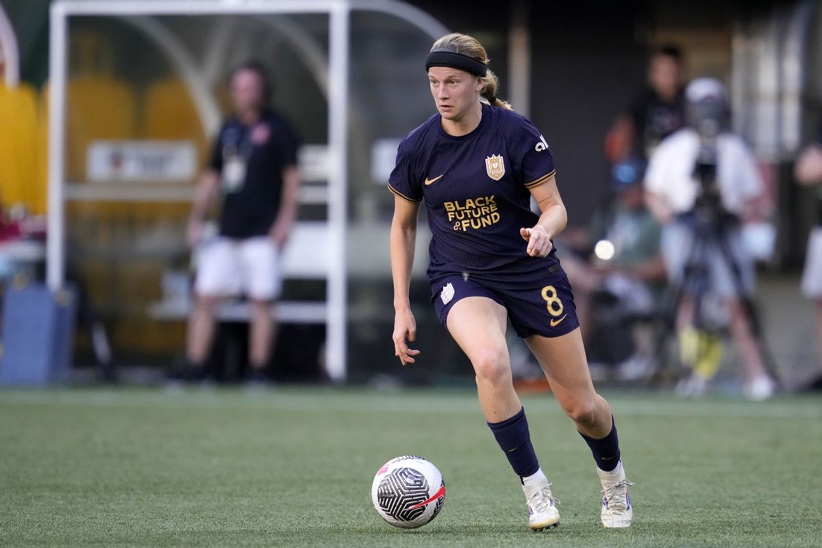 Jul 31, 2024; Portland, Oregon, USA; Seattle Reign FC forward Bethany Balcer (8) kicks the ball against Portland Thorns FC during the first half at Providence Park. Mandatory Credit: Soobum Im-USA TODAY Sports