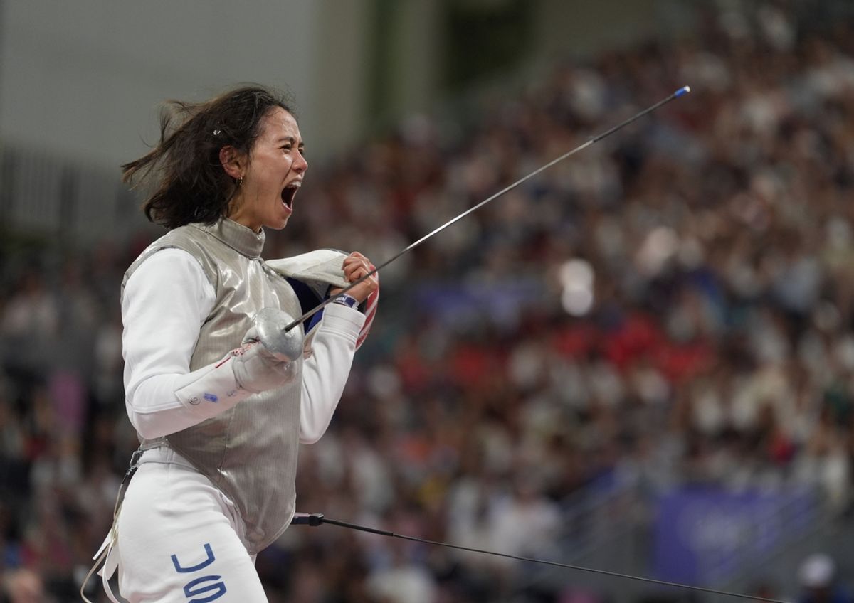 Aug 1, 2024; Paris, France; Lee Kiefer (USA) celebrates against Yuting Wang (CHN) in a women's foil team table of 8 during the Paris 2024 Olympic Summer Games at Grand Palais. Mandatory Credit: Katie Goodale-USA TODAY Sports