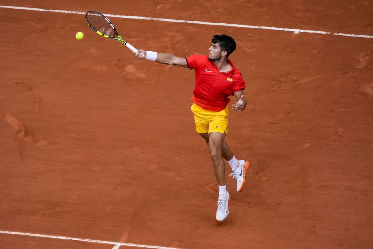 Aug 1, 2024; Paris, France; Carlos Alcaraz of Team Spain hits the ball during the Paris 2024 Olympic Summer Games at Stade Roland Garros. Mandatory Credit: Andrew P. Scott-USA TODAY Sports