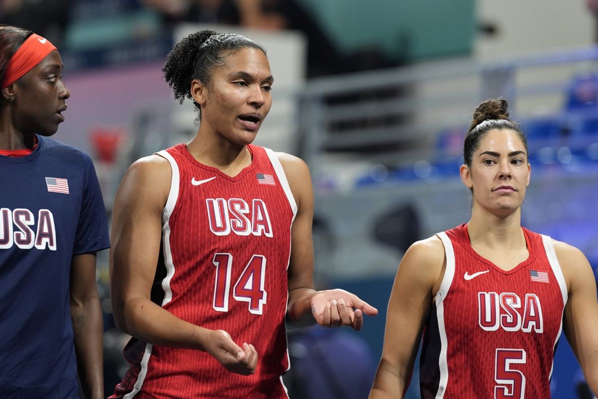 Aug 1, 2024; Villeneuve-d'Ascq, France; United States power forward Alyssa Thomas (14) and guard Kelsey Plum (5) leave the court after defeating Belgium in a women’s group stage game during the Paris 2024 Olympic Summer Games at Stade Pierre-Mauroy. Mandatory Credit: John David Mercer-USA TODAY Sports