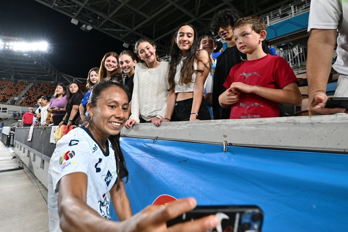 Aug 1, 2024; Houston, Texas, USA; Houston Dash forward Amanda West (16) greets fans after the match against the Houston Dash at Shell Energy Stadium. Mandatory Credit: Maria Lysaker-Imagn Images
