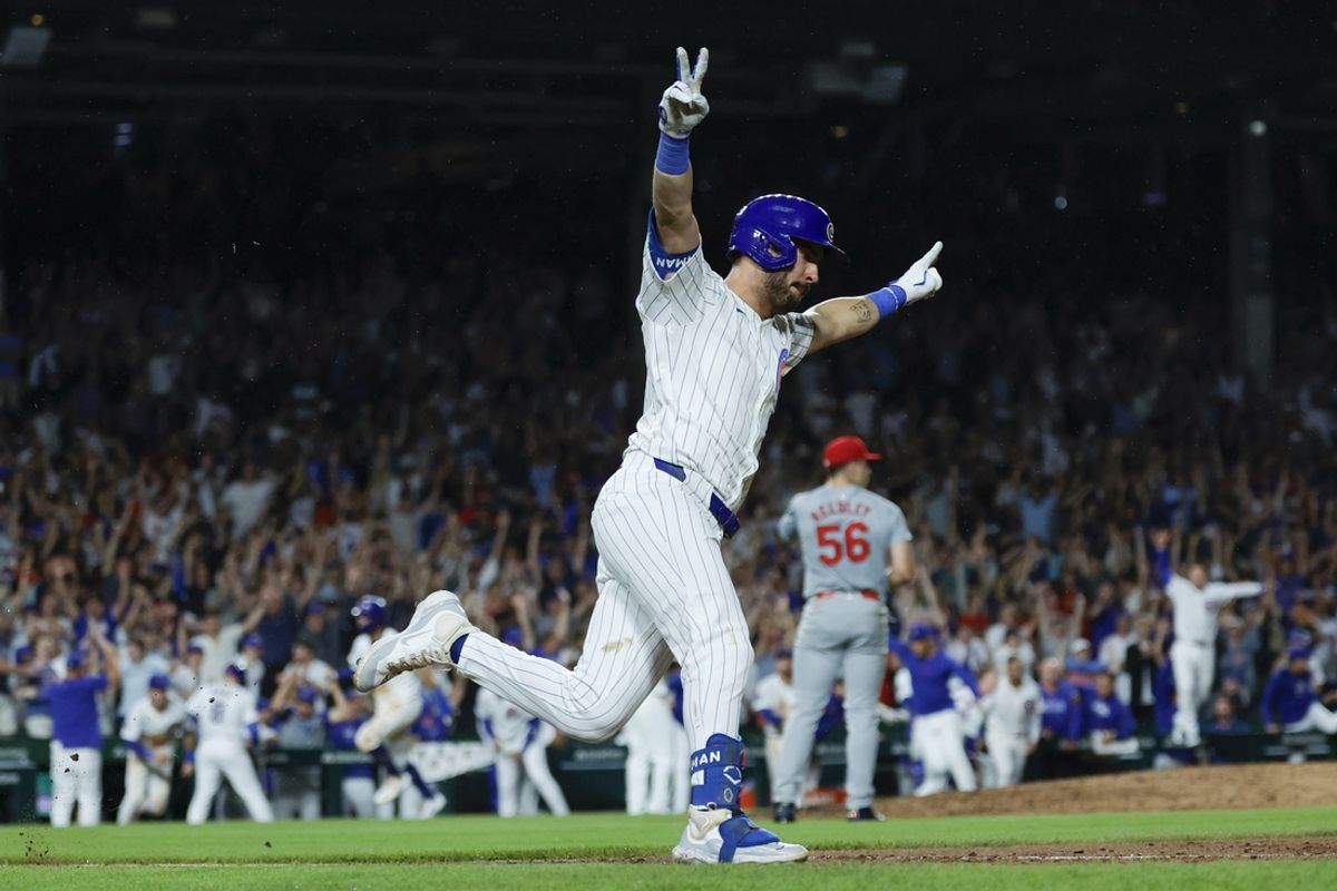 Aug 1, 2024; Chicago, Illinois, USA; Chicago Cubs outfielder Mike Tauchman (40) celebrates his walk-off single against the St. Louis Cardinals during the ninth inning at Wrigley Field. Mandatory Credit: Kamil Krzaczynski-USA TODAY Sports
