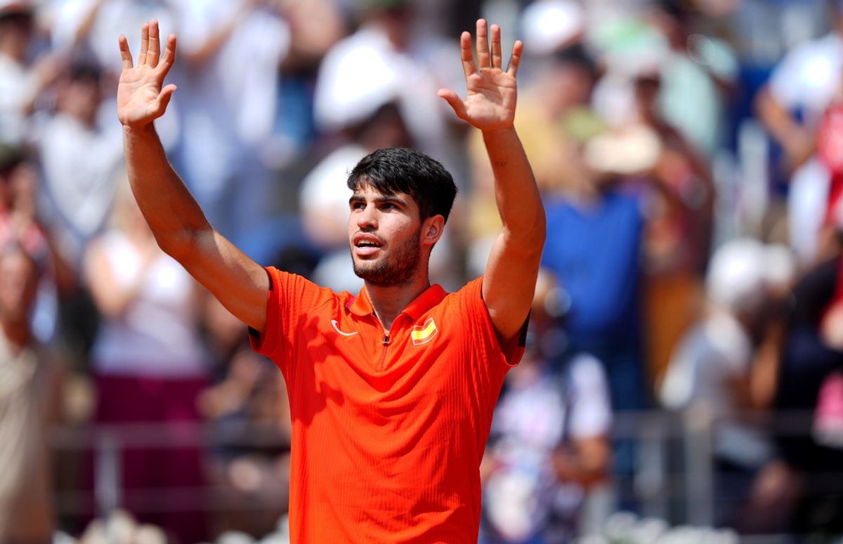 Aug 2, 2024; Paris, France; Carlos Alcaraz (ESP) celebrates after defeating Felix Auger-Aliassime (not pictured) during the Paris 2024 Olympic Summer Games at Stade Roland Garros. Mandatory Credit: Amber Searls-Imagn Images