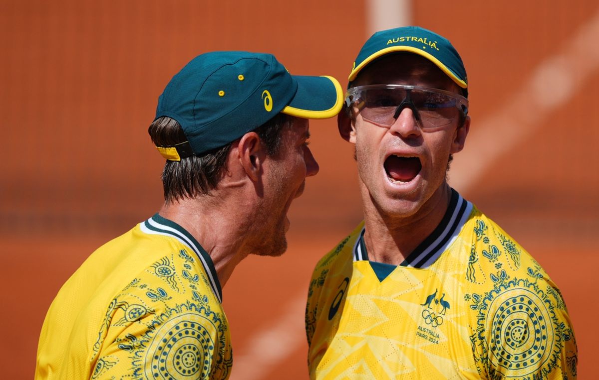 Aug 2, 2024; Paris, France; John Peers (AUS) celebrates with Matthew Ebden (AUS) after winning their semi-final doubles match against the United States during the Paris 2024 Olympic Summer Games at Stade Roland Garros. Mandatory Credit: Amber Searls-USA TODAY Sports