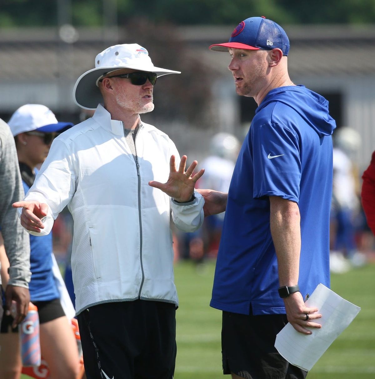 Bills head coach Sean McDermott talks with offensive coordinator Joe Brady during drills on the opening day of Buffalo Bills training camp at St. John Fisher University in Pittsford Wednesday, July 24, 2024.